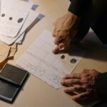 Person in Black Long Sleeve Putting Fingerprint on Paper